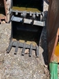 Front of used Takeuchi Bucket,Used Bucket in yard,Back of used Bucket,Front of used Bucket